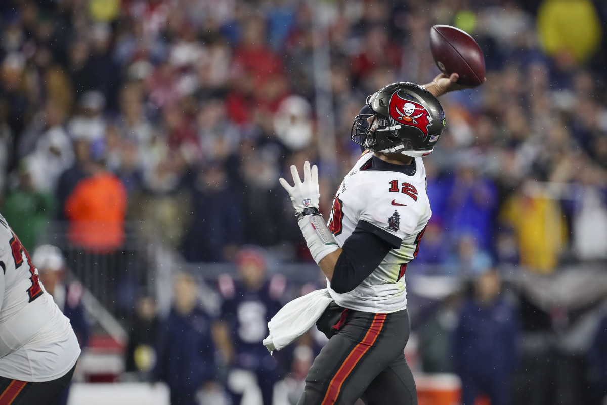 Oct 3, 2021; Foxboro, MA, USA; Tampa Bay Buccaneers quarterback Tom Brady (12) passes against the New England Patriots during the second half at Gillette Stadium. Mandatory Credit: Paul Rutherford-USA TODAY Sports